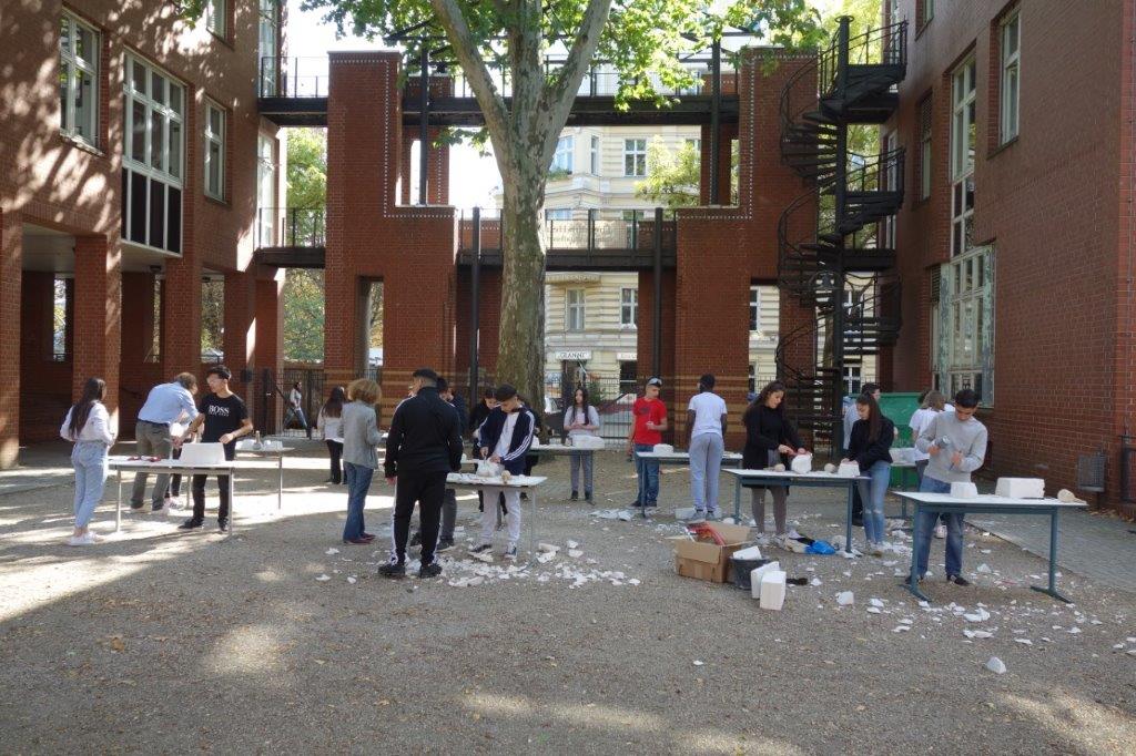 Children standing in a courtyard