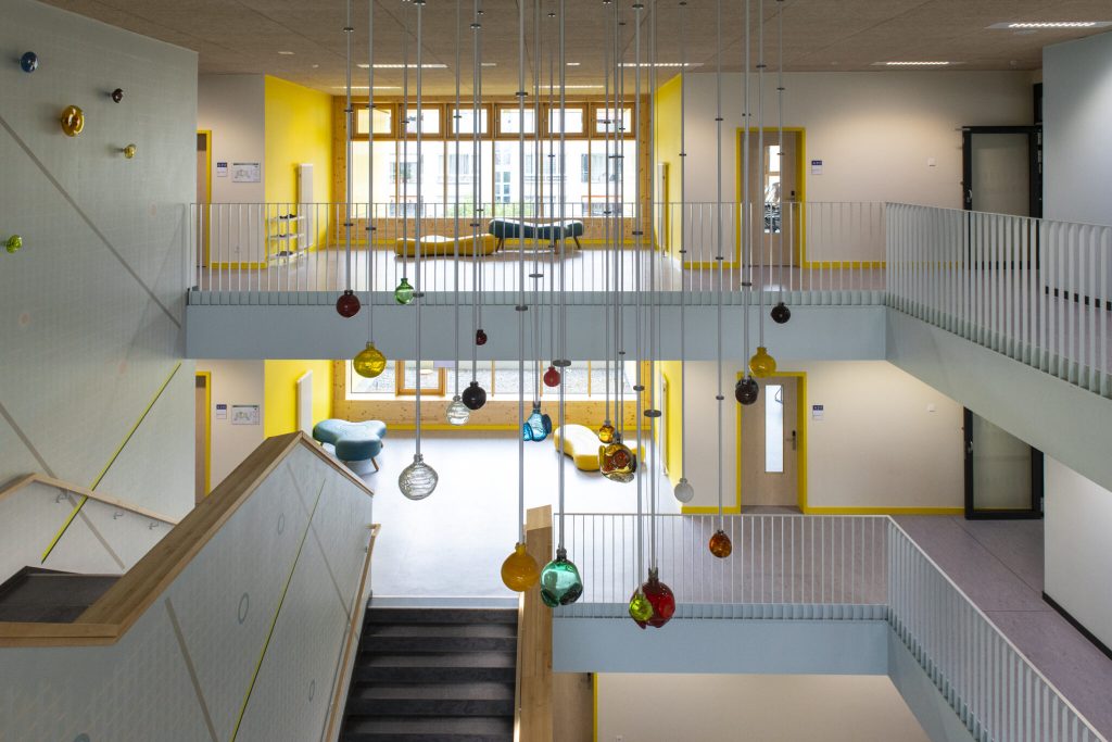 Colourful glass spheres hanging from a ceiling